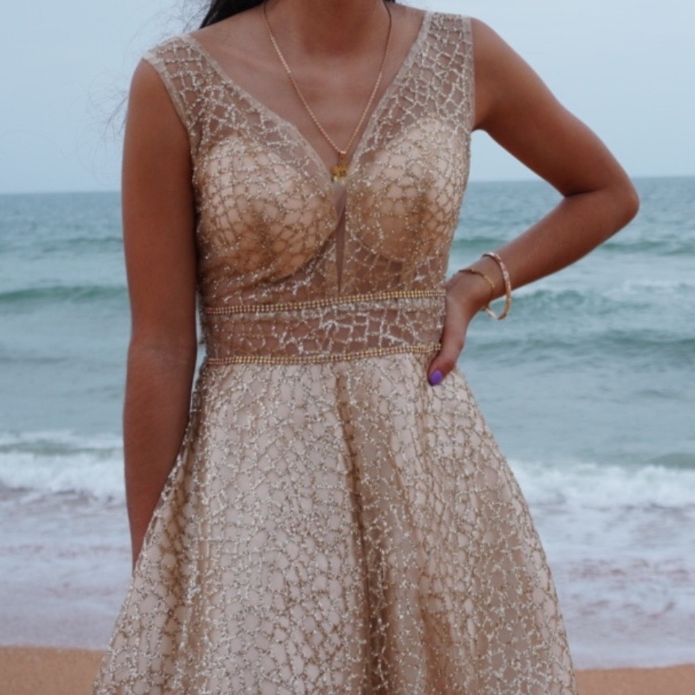 short gold and sparkly quinceañera dress
